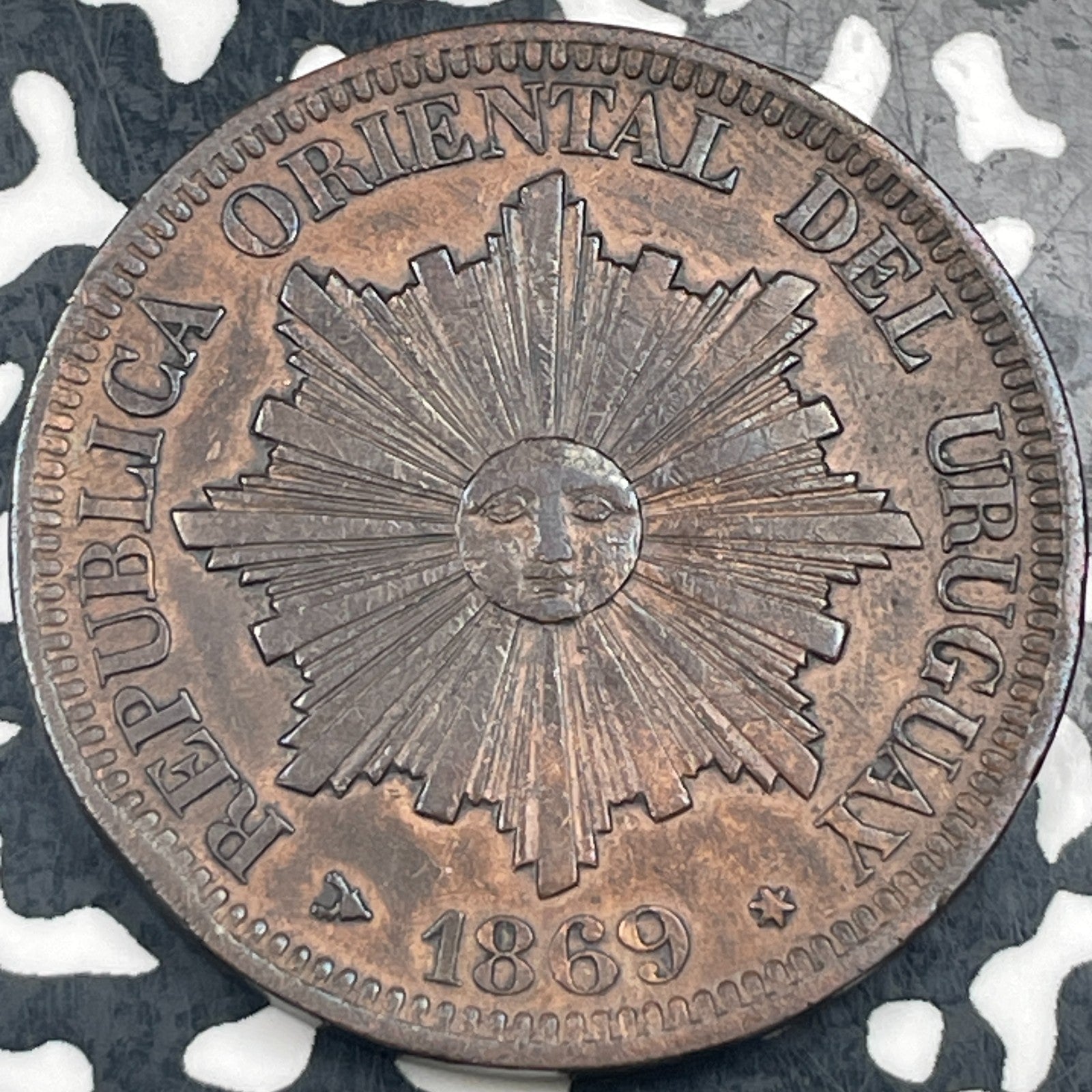 1869-H Uruguay 4 Centesimos Lot#N3694 Rim Hit